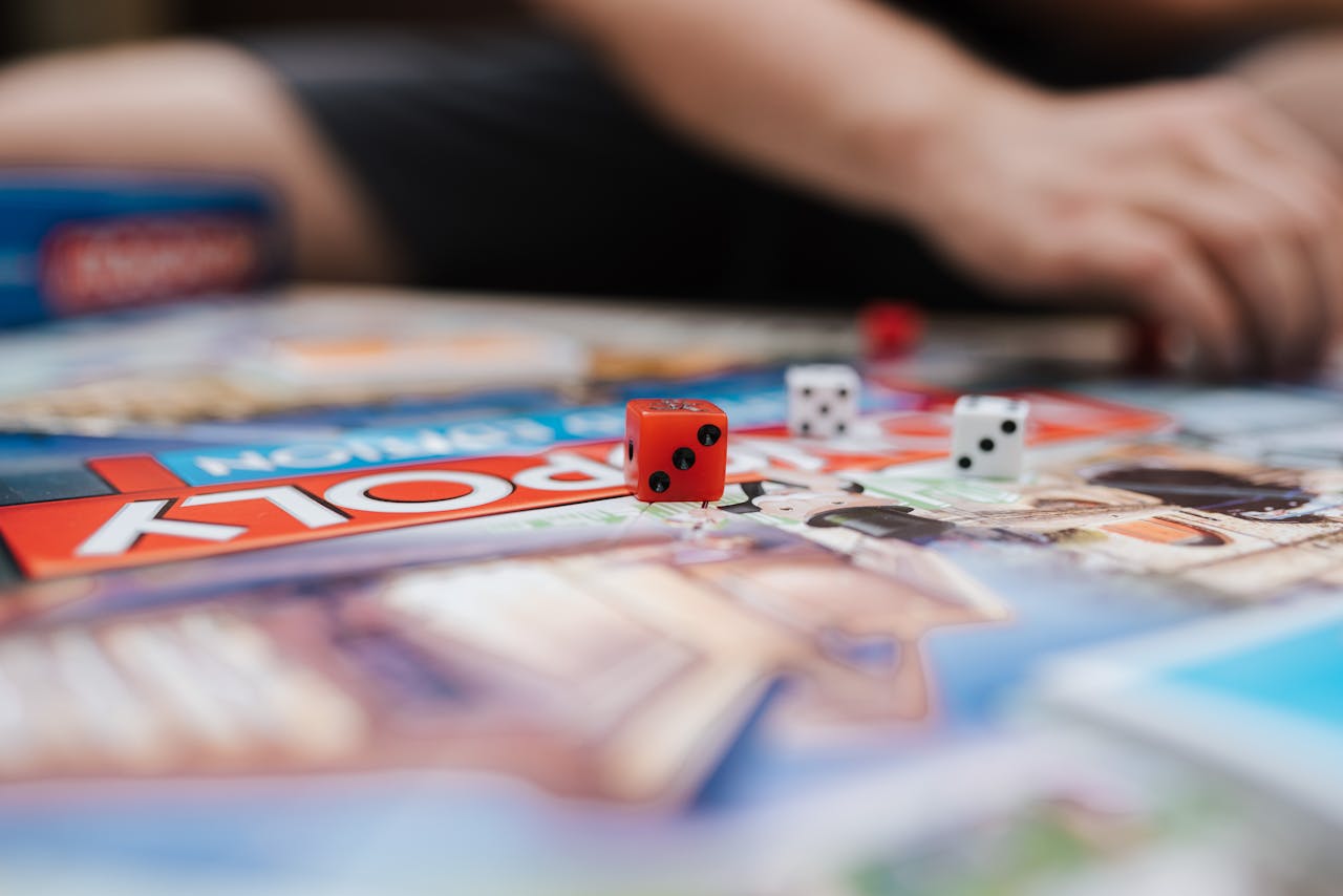 Intimate view of Monopoly board game showing dice, evoking family fun at home.